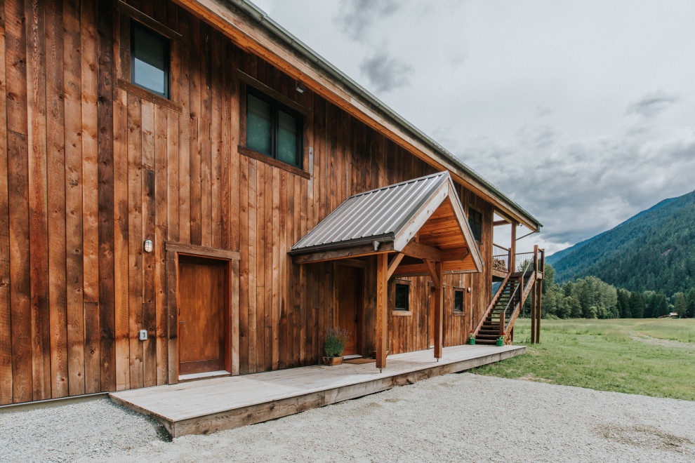 Entryway - rustic exposed beam entryway idea in Vancouver