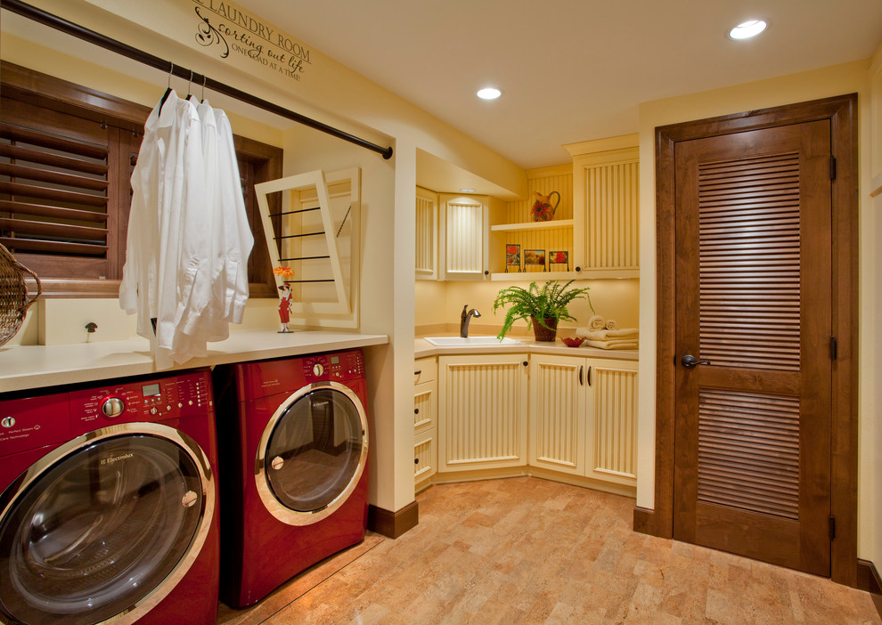 Design ideas for a traditional laundry room in Portland with beige cabinets, beige floor and beige benchtop.