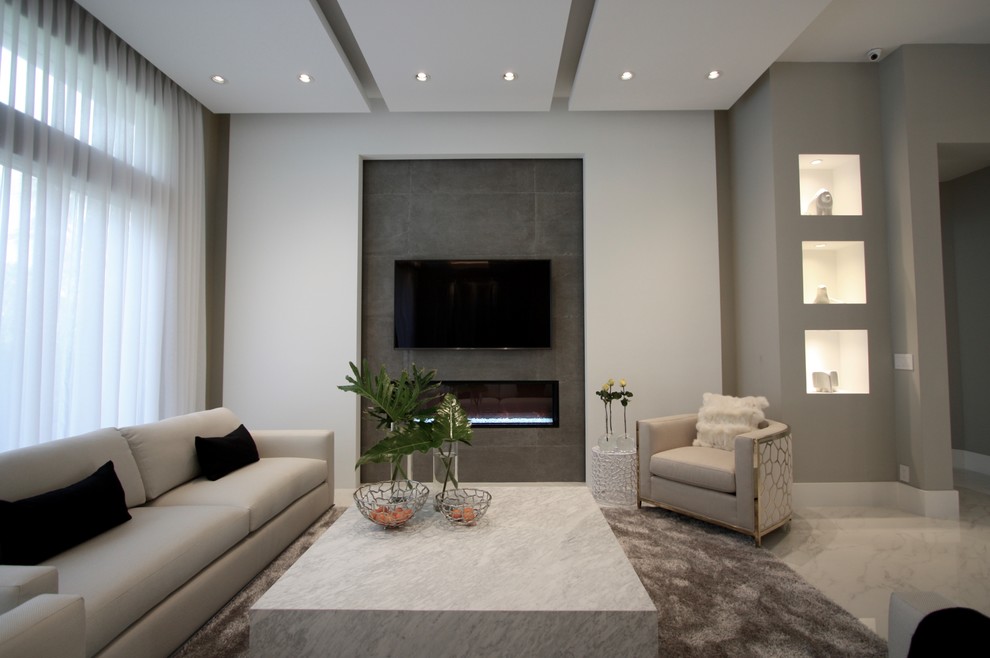 Design ideas for a contemporary living room in Miami with grey walls, marble floors, a ribbon fireplace, a tile fireplace surround and a wall-mounted tv.