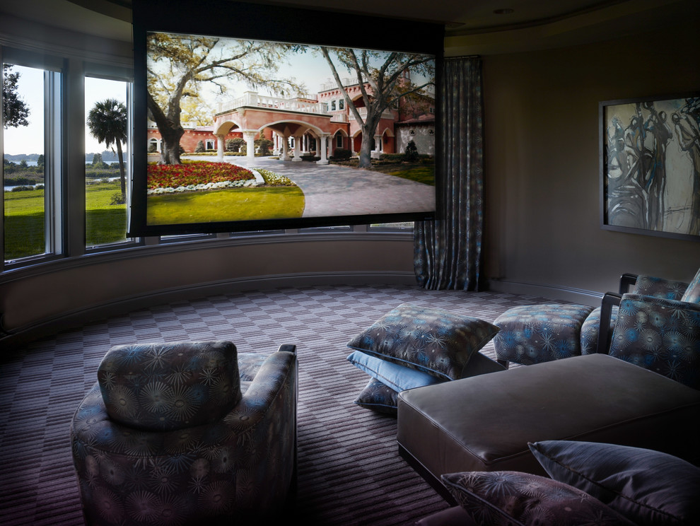 Design ideas for a large contemporary enclosed home theatre in Tampa with carpet, a projector screen, multi-coloured floor and grey walls.