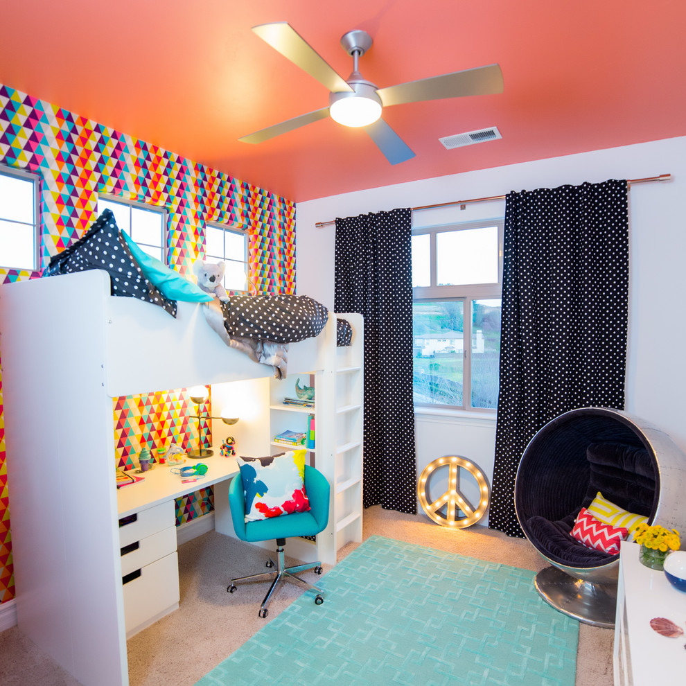 This is an example of a small modern kids' bedroom for girls in Sacramento with carpet and multi-coloured walls.