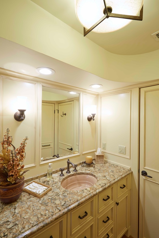 Design ideas for a small traditional 3/4 bathroom in Jacksonville with an undermount sink, recessed-panel cabinets, beige cabinets, engineered quartz benchtops, a drop-in tub, a one-piece toilet, beige walls and light hardwood floors.