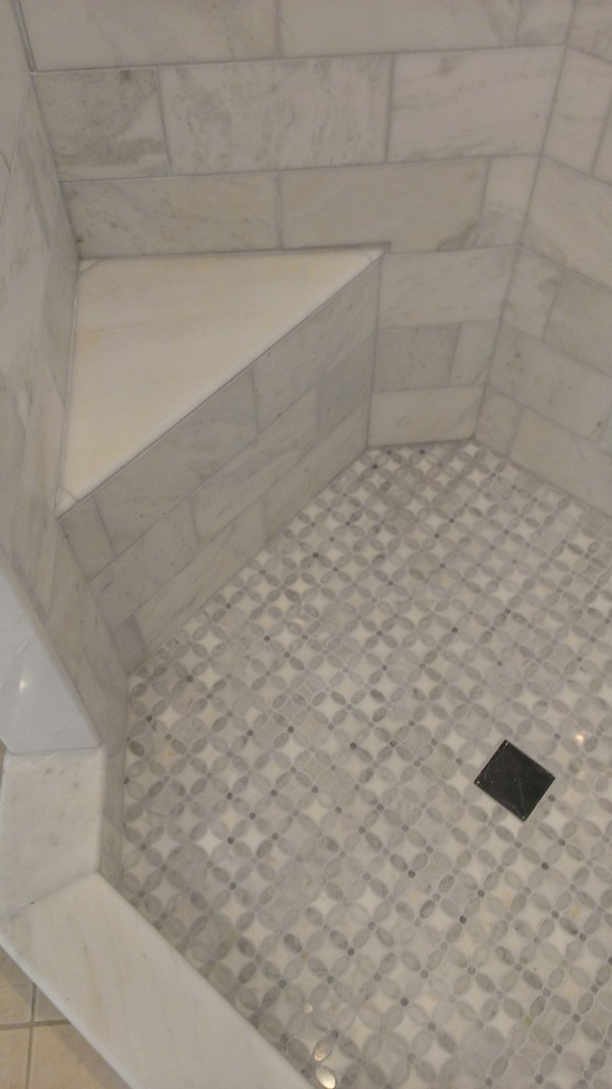 Inspiration for a contemporary bathroom in Austin with a corner shower, gray tile and subway tile.