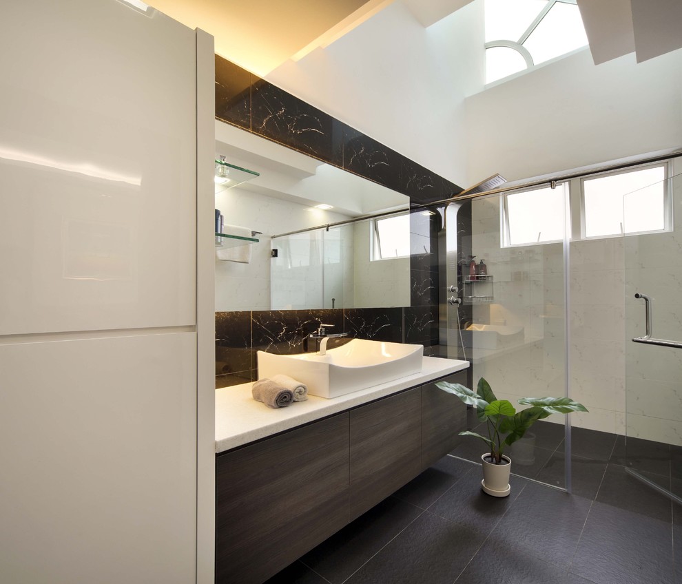 This is an example of a modern bathroom in Singapore with a vessel sink and white benchtops.
