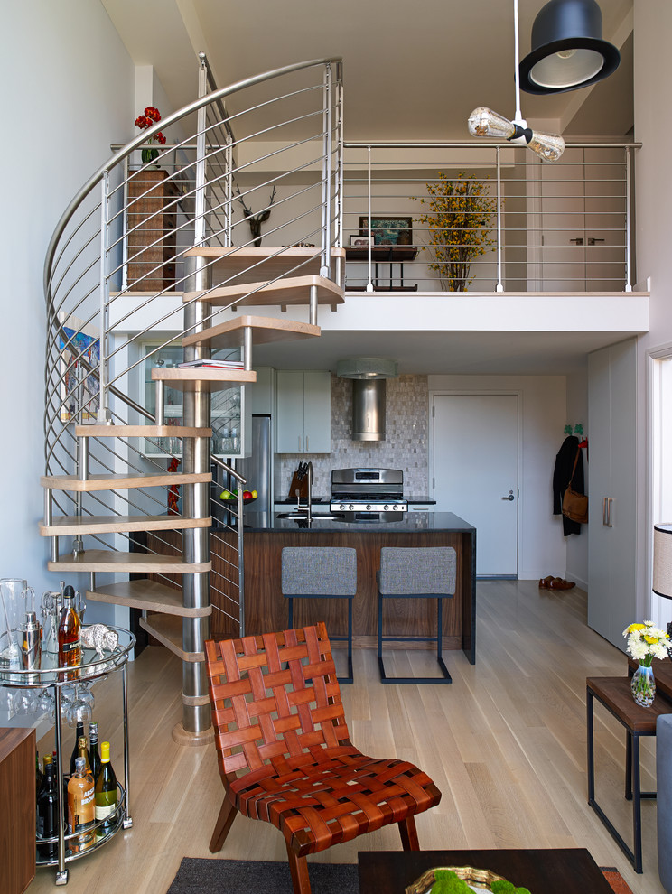 Small contemporary spiral staircase in New York with open risers.