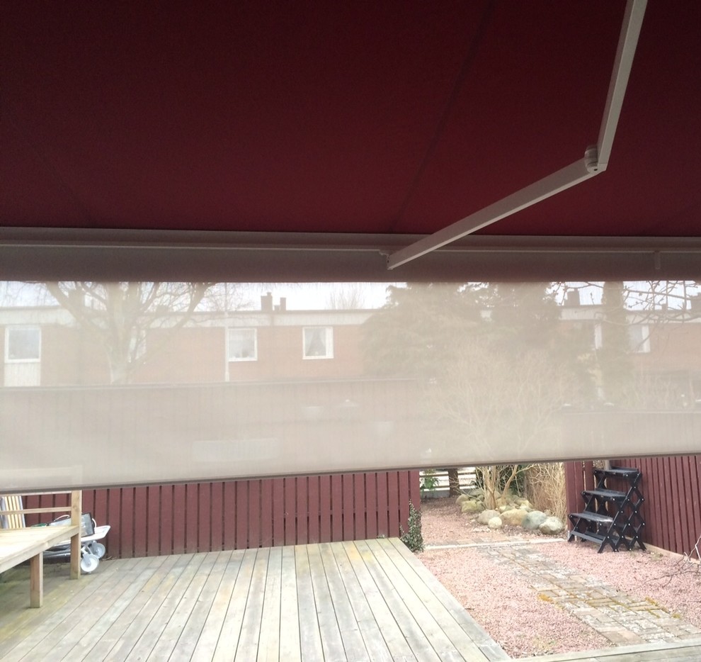 This is an example of a scandinavian patio in Other with an awning.
