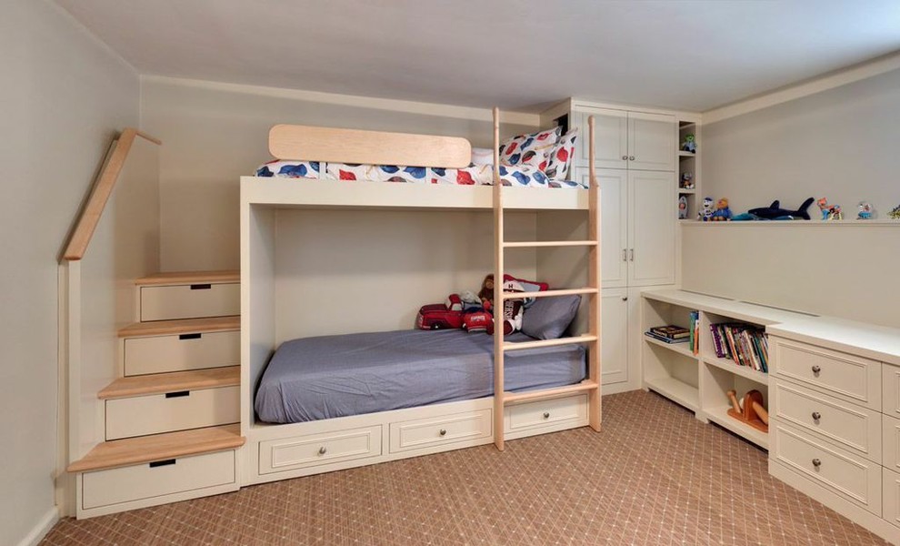 Photo of a traditional kids' bedroom for kids 4-10 years old and boys in New York with blue walls and carpet.