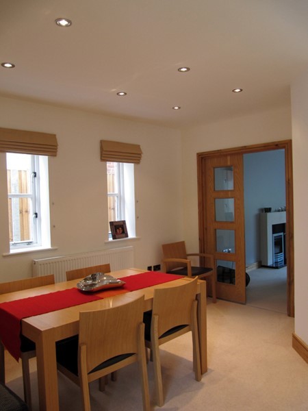 This is an example of a contemporary dining room in Hertfordshire.