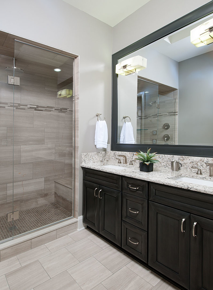 Photo of a mid-sized eclectic master bathroom in Other with an undermount sink, raised-panel cabinets, dark wood cabinets, granite benchtops, gray tile, stone tile, grey walls and marble floors.