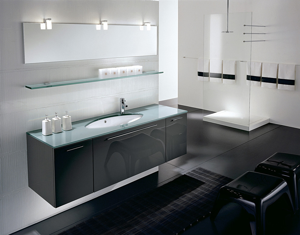 Inspiration for a modern bathroom in Los Angeles with an undermount sink, flat-panel cabinets, grey cabinets, glass benchtops, an open shower and white tile.