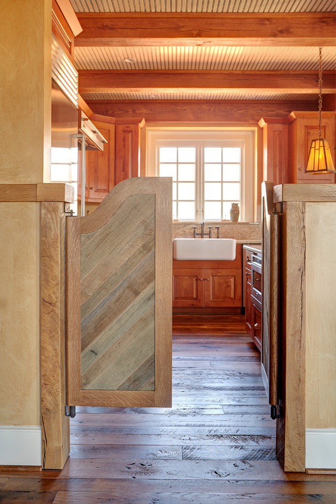 Open concept kitchen - mid-sized rustic dark wood floor open concept kitchen idea with a farmhouse sink, shaker cabinets, distressed cabinets, granite countertops, multicolored backsplash, stainless steel appliances and an island