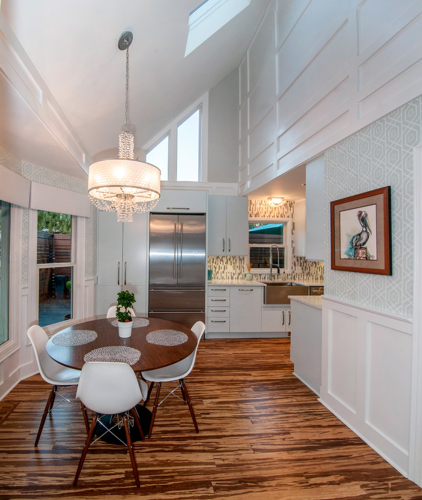 Transitional kitchen/dining combo in Wilmington with grey walls and dark hardwood floors.