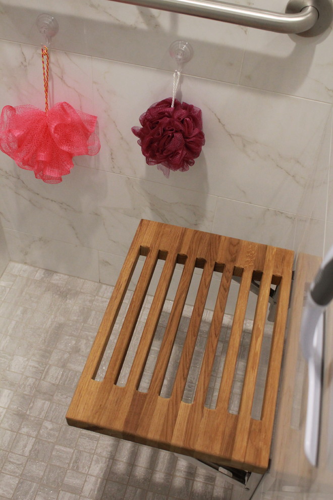 Inspiration for a small transitional master white tile and porcelain tile porcelain tile and gray floor bathroom remodel in Houston with shaker cabinets, gray cabinets, gray walls, granite countertops and a hinged shower door