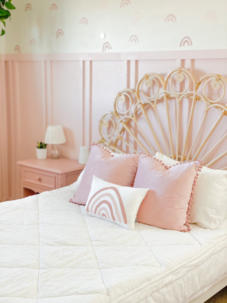 Photo of a rural kids' bedroom for girls in Denver with pink walls and wainscoting.