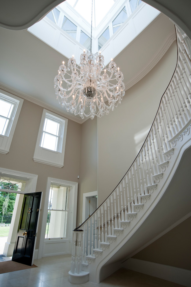 Photo of an expansive traditional hallway in Surrey with beige walls, porcelain floors and beige floor.