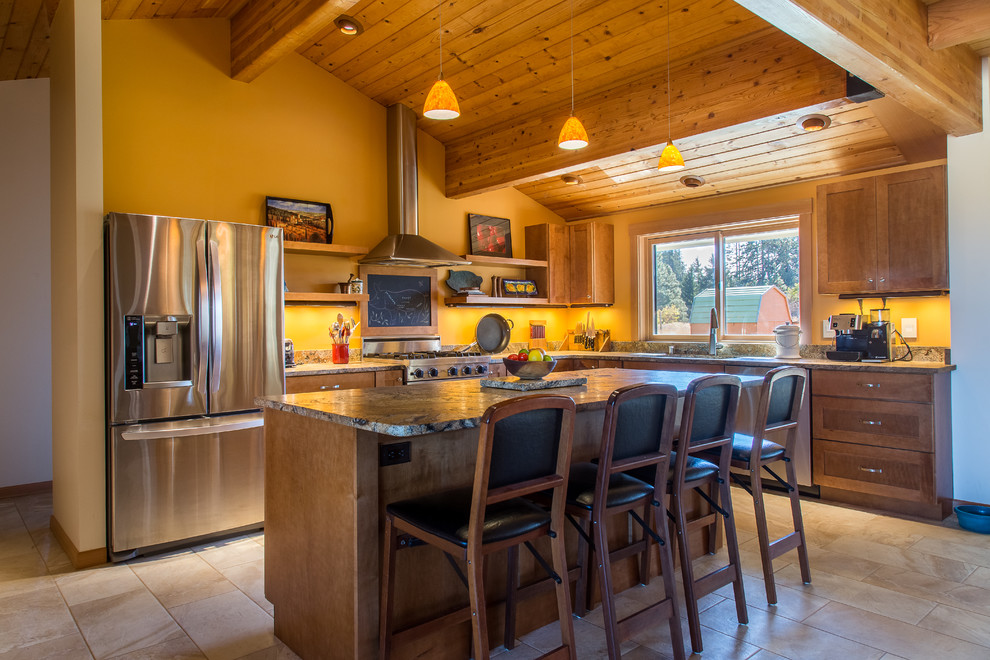 Inspiration for a large transitional l-shaped travertine floor open concept kitchen remodel in Portland with an undermount sink, recessed-panel cabinets, medium tone wood cabinets, granite countertops, multicolored backsplash, stainless steel appliances and an island