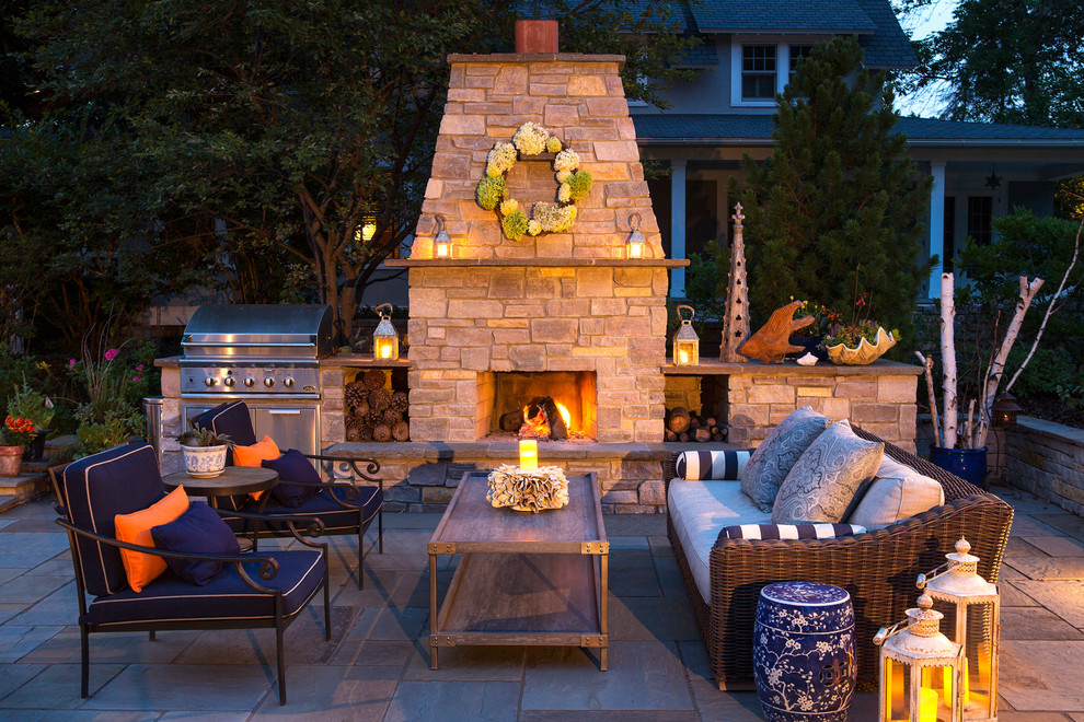 Traditional patio in Minneapolis with no cover and with fireplace.