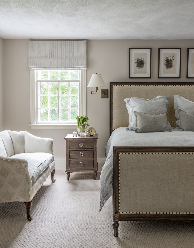 Example of a beach style carpeted bedroom design in Boston with beige walls and no fireplace