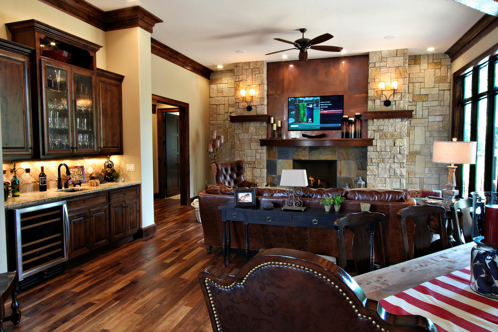 Photo of a country family room in Kansas City with beige walls, medium hardwood floors, a standard fireplace and a tile fireplace surround.