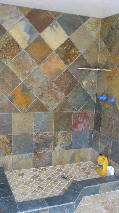 This is an example of a mid-sized transitional bathroom in Los Angeles with beige tile, black tile, brown tile, gray tile, multi-coloured tile, orange tile, stone tile and limestone floors.