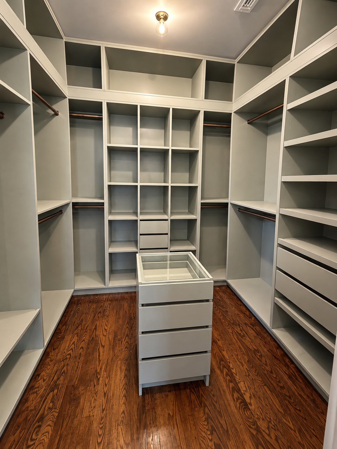 Custom Walk-In Closet with Built-In Storage & Glass-Top Island