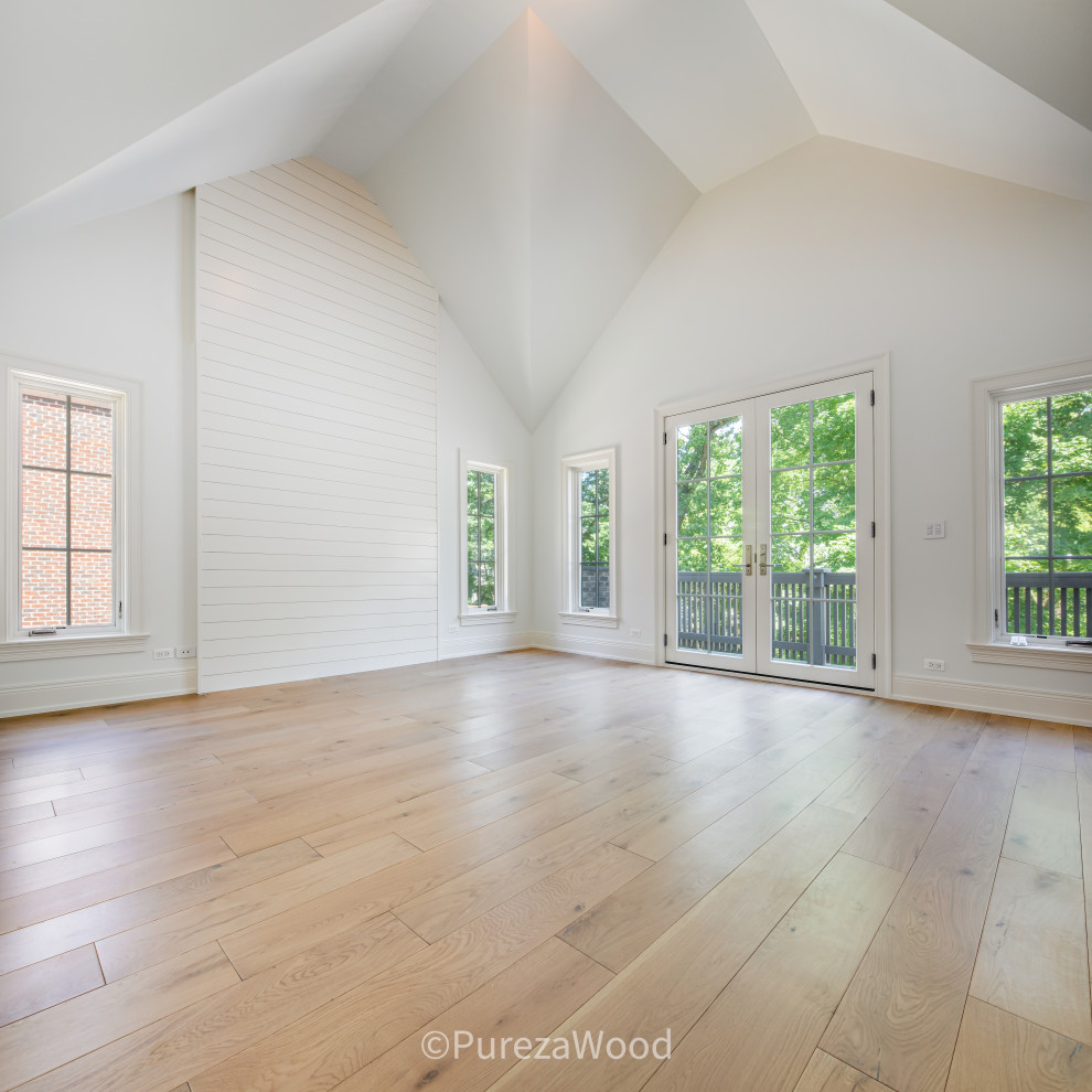 Design ideas for a large traditional enclosed games room in Chicago with white walls, light hardwood flooring, beige floors and a vaulted ceiling.