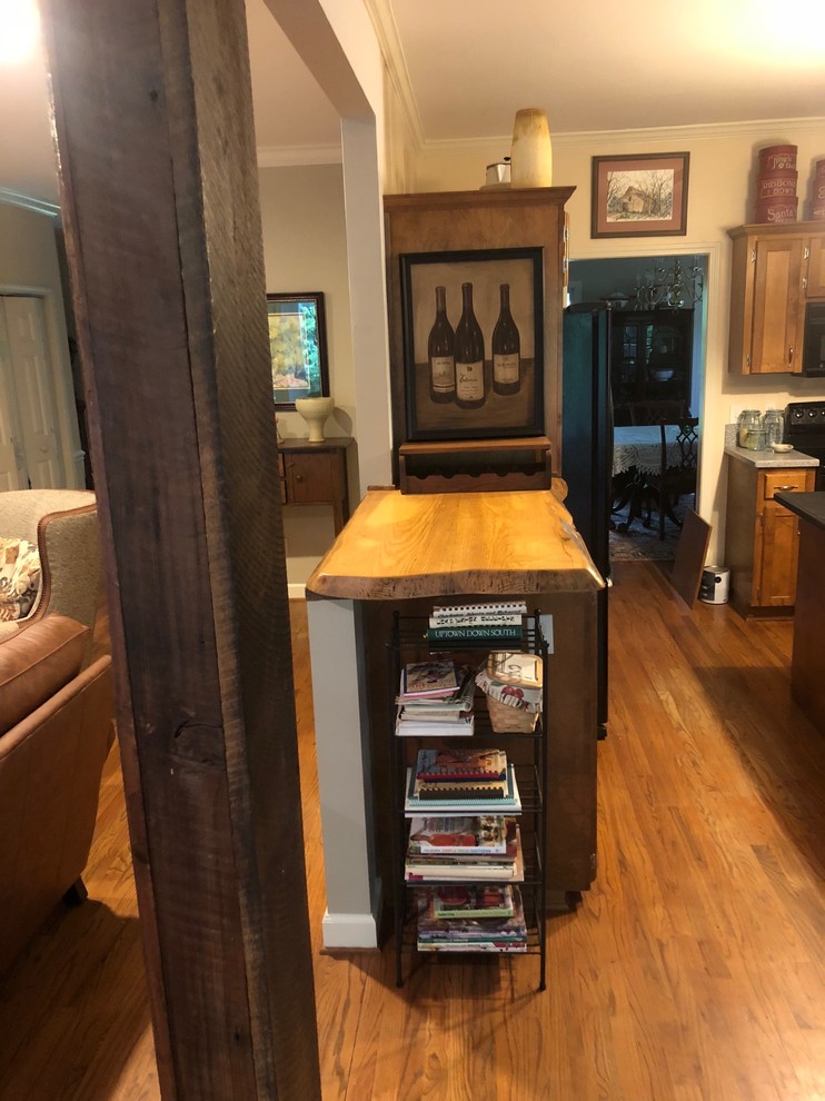Inspiration for a mid-sized rustic l-shaped home design remodel with wood countertops and brown countertops