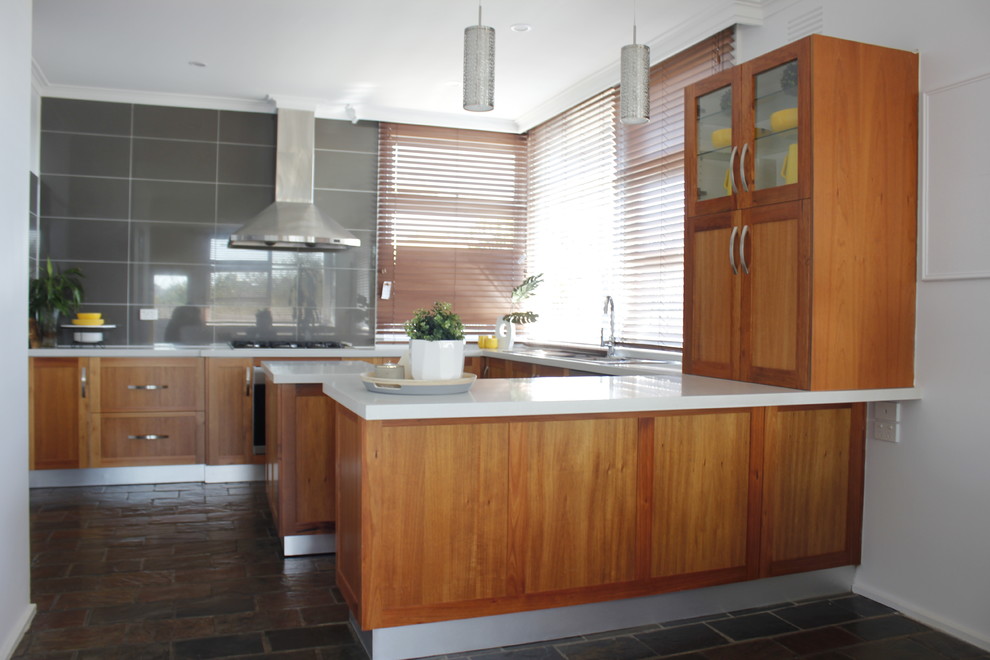 Design ideas for a small contemporary u-shaped eat-in kitchen in Melbourne with a single-bowl sink, beaded inset cabinets, medium wood cabinets, granite benchtops, grey splashback, ceramic splashback, stainless steel appliances, ceramic floors and with island.
