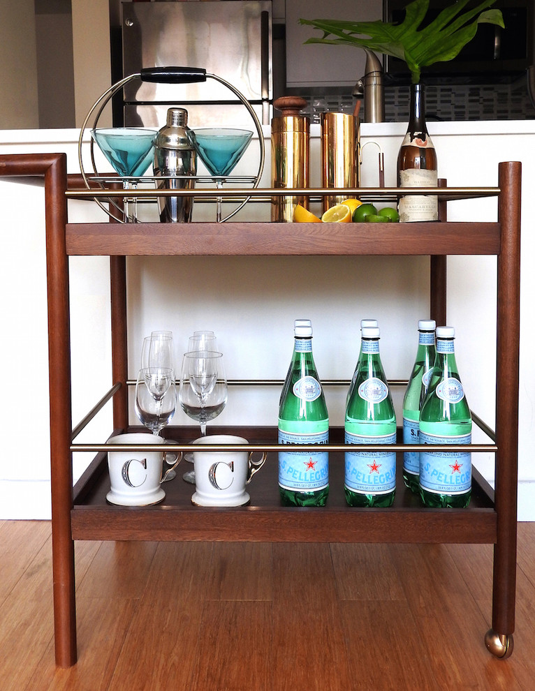 Design ideas for a small contemporary bar cart in New York with light hardwood floors, beige floor and wood benchtops.
