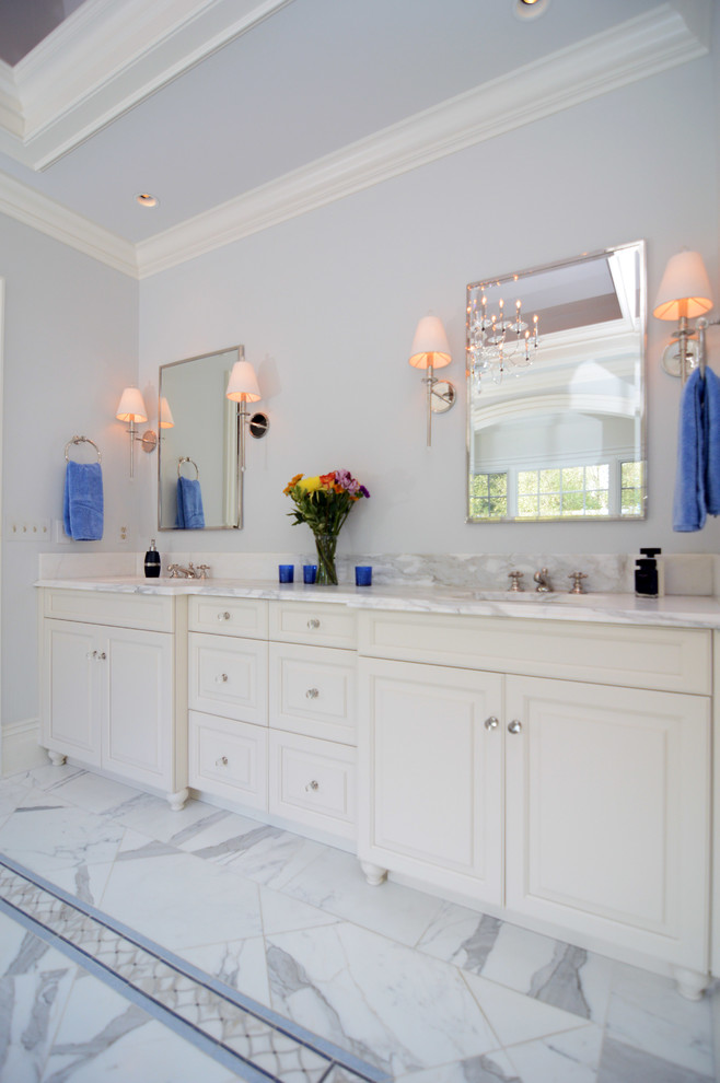 Expansive arts and crafts master bathroom in DC Metro with recessed-panel cabinets, white cabinets, a freestanding tub, an alcove shower, white tile, stone tile, white walls and marble floors.