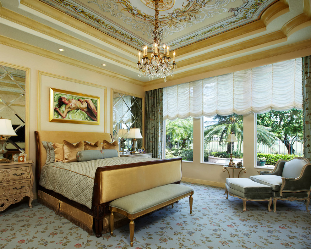 This is an example of a traditional bedroom in Miami with beige walls, carpet, no fireplace and blue floor.