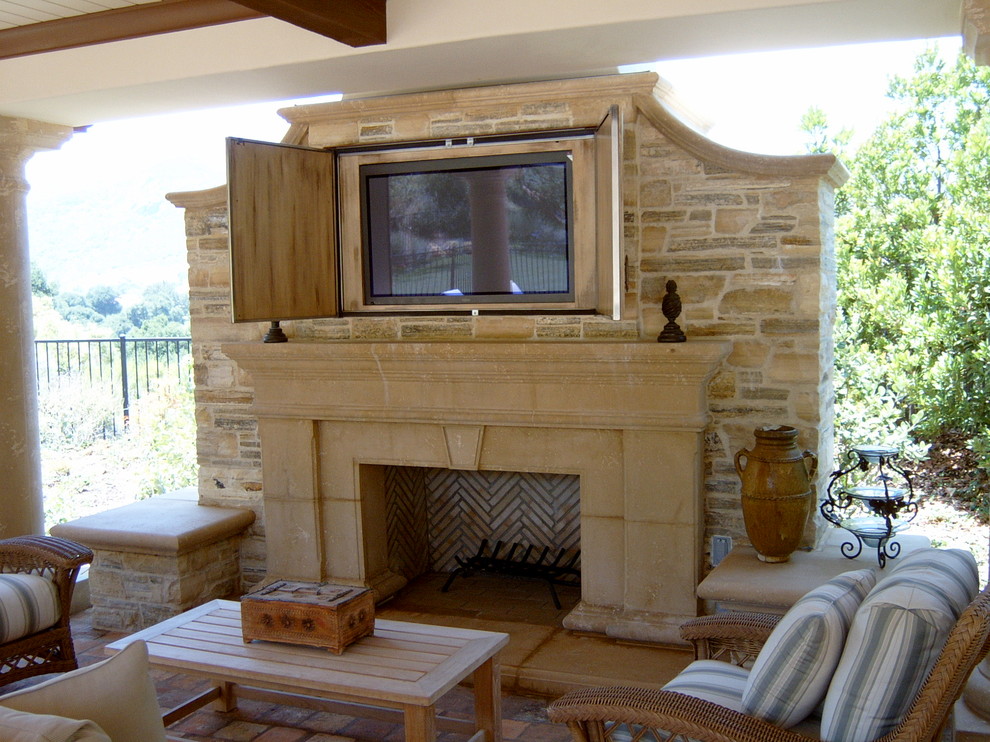 Photo of a traditional patio in Los Angeles with a fire feature and a pergola.