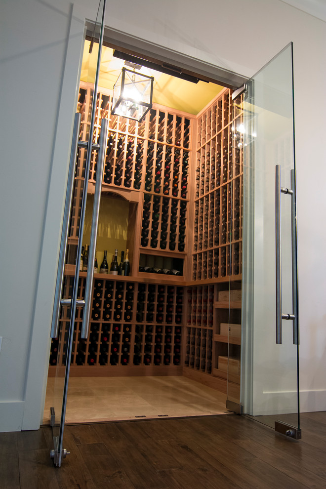 Design ideas for a small traditional wine cellar in San Francisco with limestone floors, display racks and beige floor.