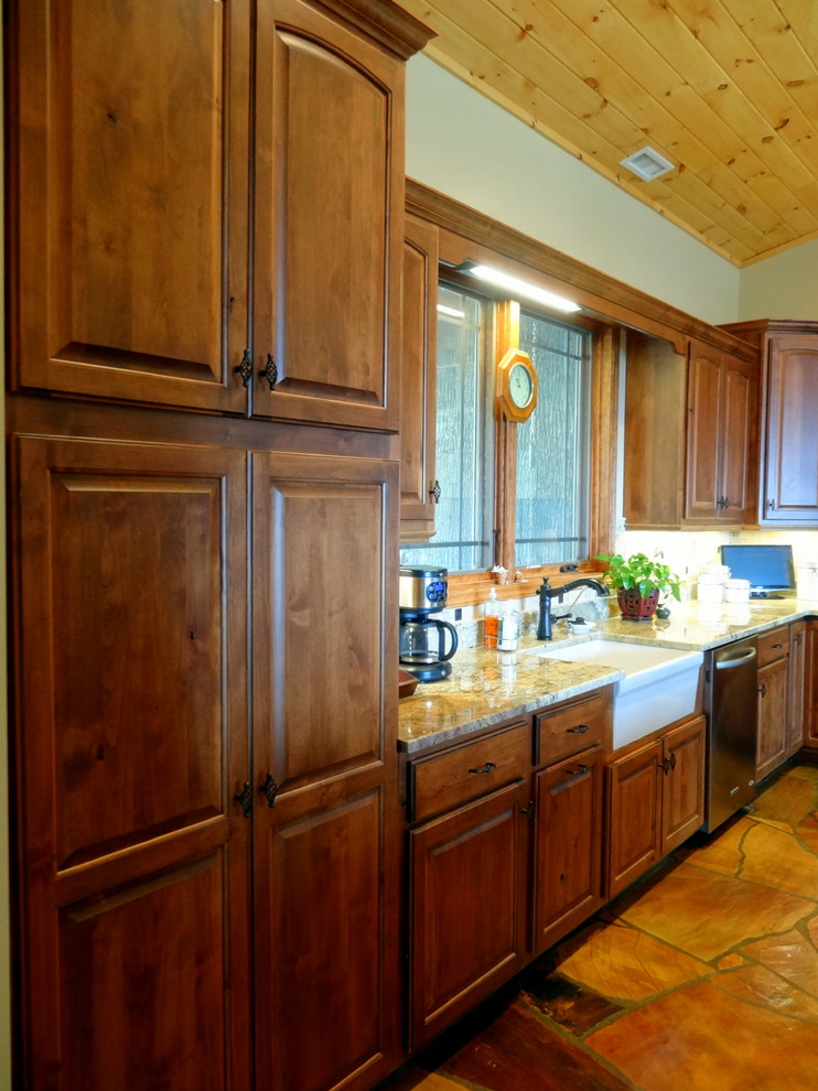 Open concept kitchen - mid-sized rustic l-shaped slate floor open concept kitchen idea in Charlotte with a farmhouse sink, raised-panel cabinets, dark wood cabinets, granite countertops, multicolored backsplash, ceramic backsplash, stainless steel appliances and a peninsula