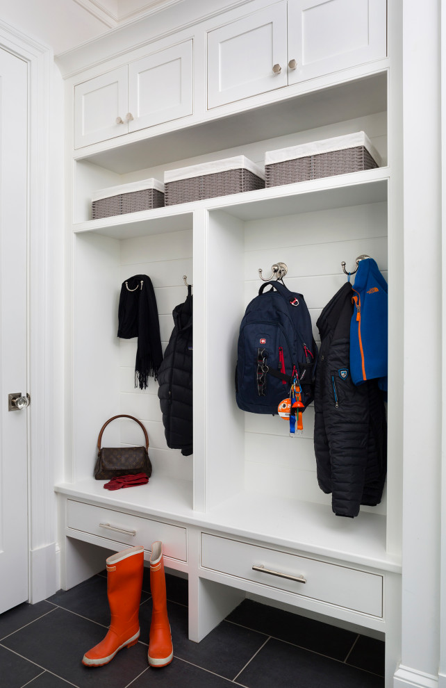 Photo of a small transitional mudroom in DC Metro with white walls, porcelain floors, a single front door, a white front door and grey floor.