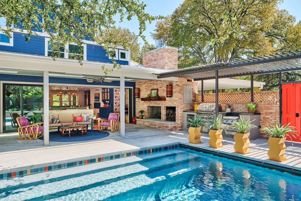Pool - mid-sized eclectic backyard concrete paver and rectangular pool idea in Austin