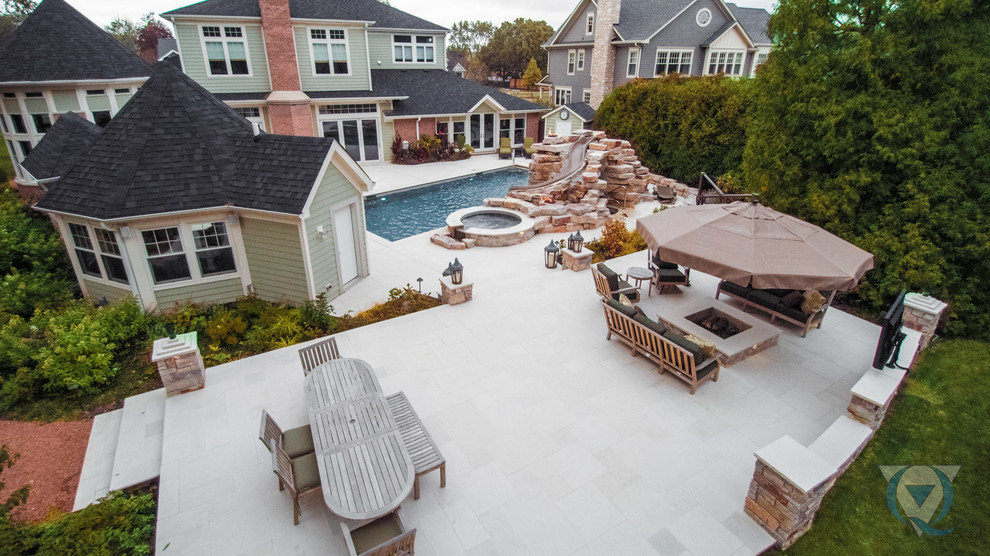 Example of a large mountain style backyard rectangular lap water slide design in Chicago