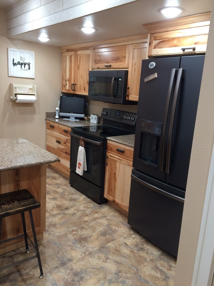 Inspiration for a mid-sized rustic l-shaped vinyl floor and multicolored floor eat-in kitchen remodel with an undermount sink, recessed-panel cabinets, medium tone wood cabinets, granite countertops, black appliances, an island and gray countertops
