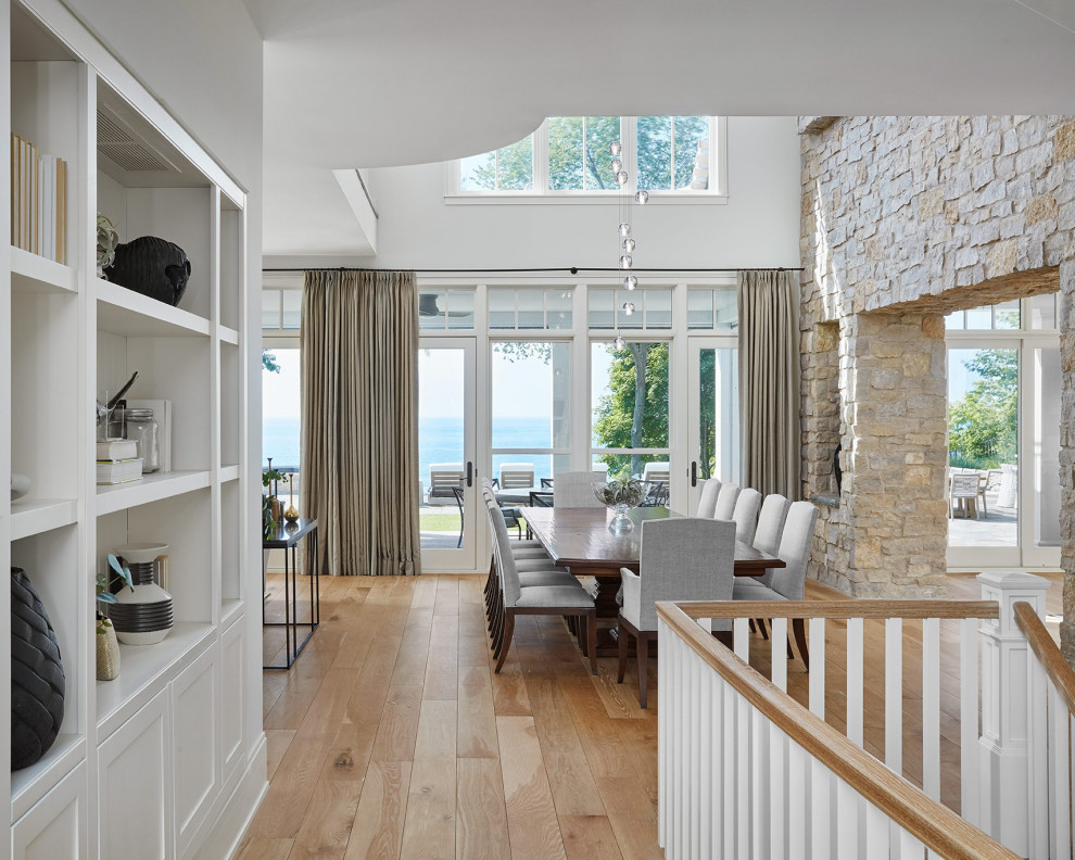 Lakehouse Lux - Example of a beach style dining room design in Chicago