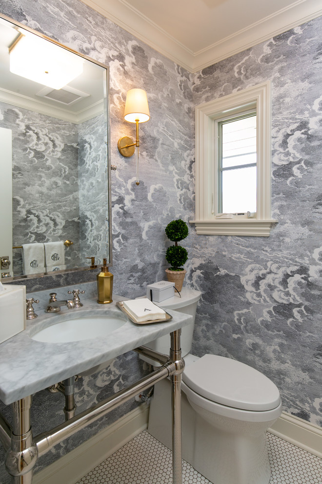 Inspiration for a mid-sized transitional powder room in Kansas City with a two-piece toilet, porcelain floors, a console sink, marble benchtops, white floor and white benchtops.