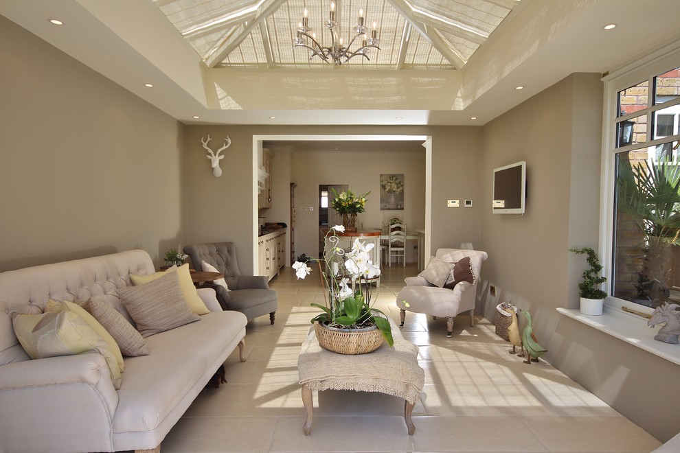 Photo of a large traditional sunroom in Other with a skylight and beige floor.