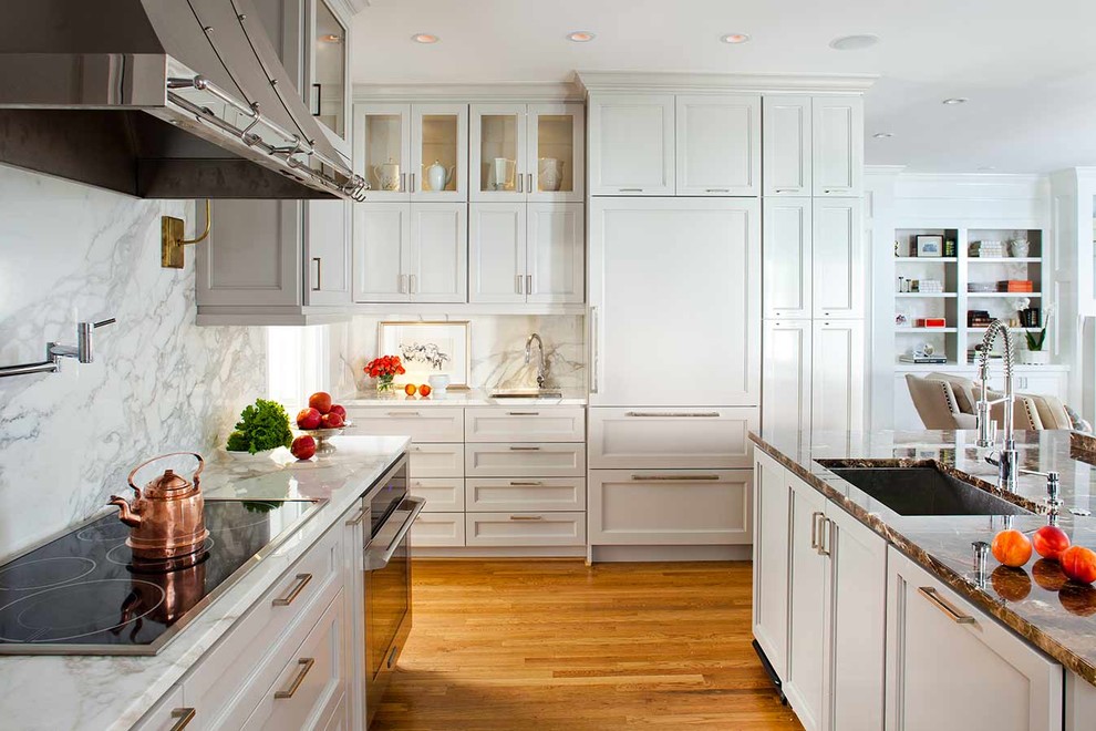 This is an example of a transitional l-shaped eat-in kitchen in Atlanta with an undermount sink, recessed-panel cabinets, grey cabinets, marble benchtops, white splashback, panelled appliances and marble splashback.