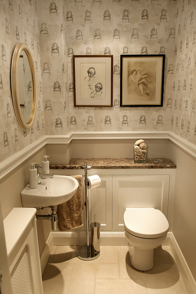 This is an example of a traditional powder room in London with marble benchtops.