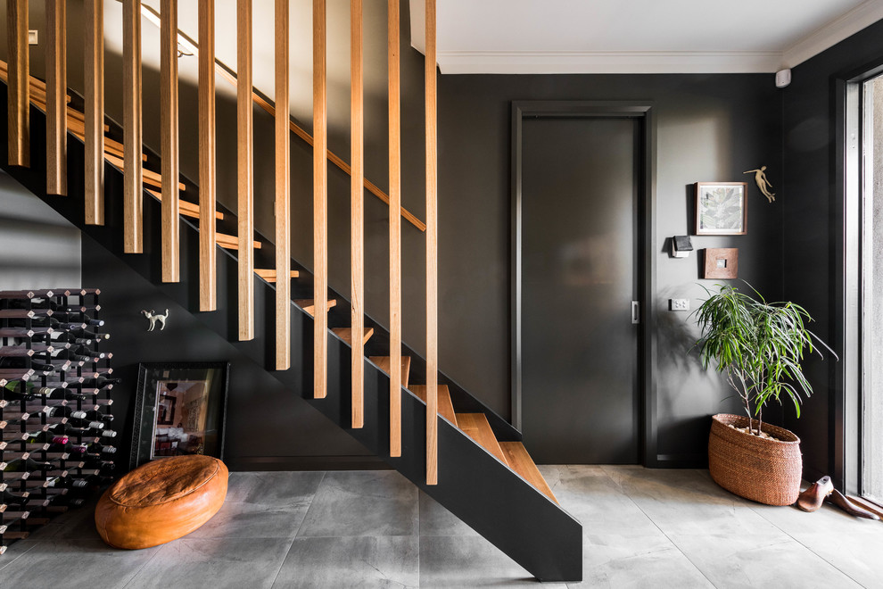 Inspiration for a contemporary wood straight staircase in Melbourne with open risers and wood railing.