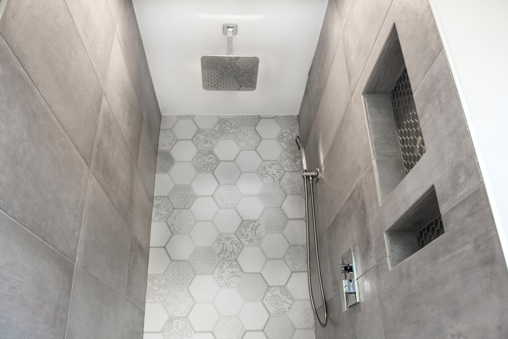 This is an example of a mid-sized contemporary master bathroom in Houston with an alcove shower, multi-coloured tile, porcelain tile, grey walls, porcelain floors, white floor and an open shower.