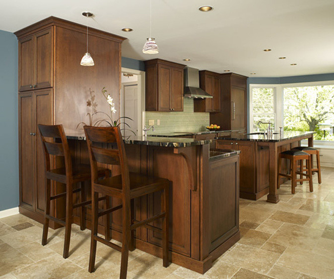 Mid-sized transitional l-shaped travertine floor eat-in kitchen photo in Philadelphia with an undermount sink, shaker cabinets, medium tone wood cabinets, granite countertops, green backsplash, stainless steel appliances, blue walls and an island