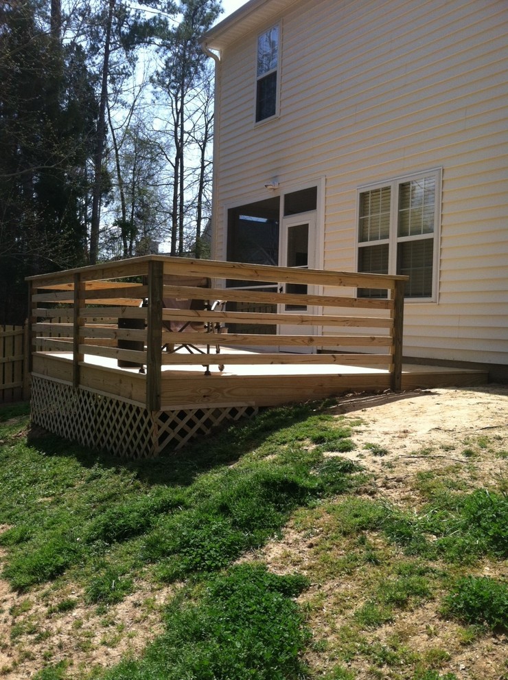 Deck - rustic deck idea in Raleigh