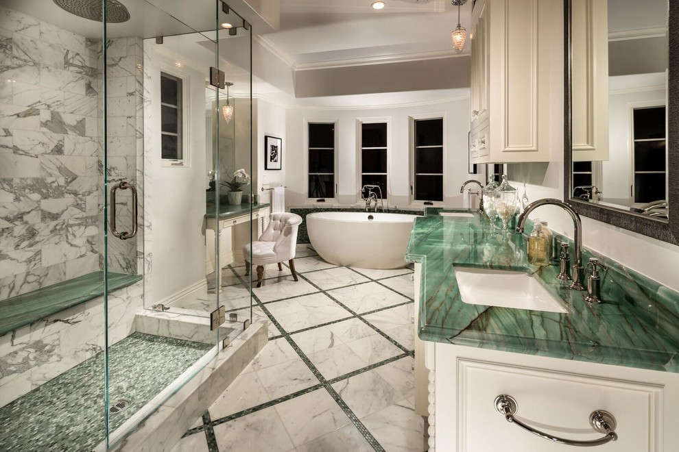 Photo of a transitional master bathroom in Los Angeles with white cabinets, a freestanding tub, an alcove shower, gray tile, green tile, white walls, an undermount sink, a hinged shower door and green benchtops.