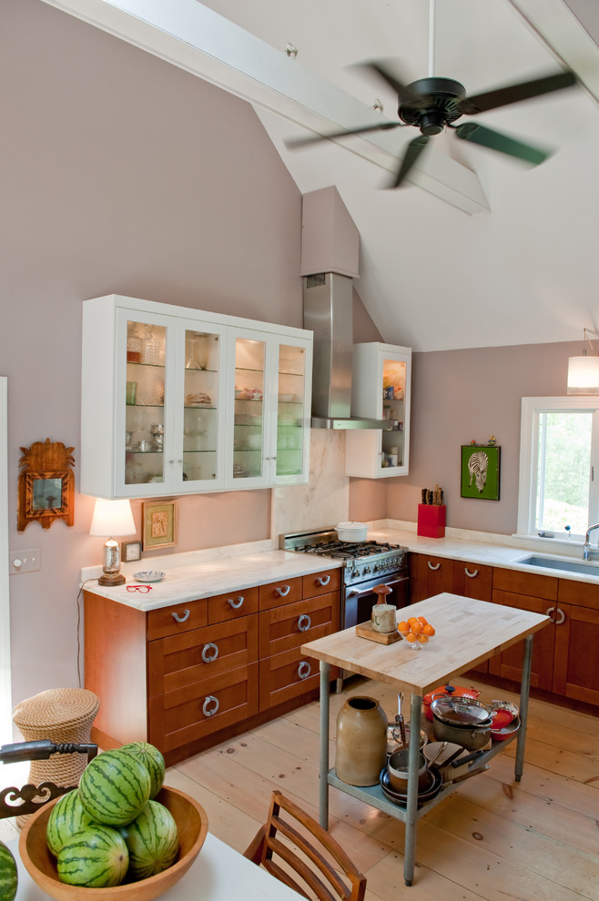 Kitchen - transitional light wood floor kitchen idea in Boston with an undermount sink, shaker cabinets, marble countertops, stone slab backsplash, stainless steel appliances, purple walls, an island and medium tone wood cabinets