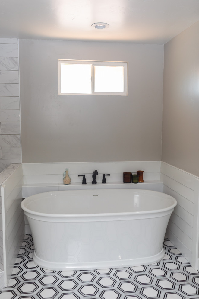Large rural ensuite bathroom in San Diego with shaker cabinets, white cabinets, a freestanding bath, a corner shower, white tiles, ceramic tiles, grey walls, vinyl flooring, a built-in sink, quartz worktops, grey floors, an open shower, white worktops, a shower bench, double sinks and a built in vanity unit.